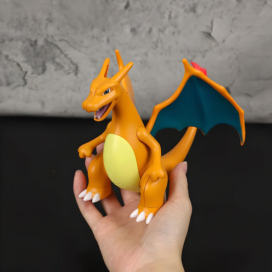 Hand holding Charizard-inspired humidifier figure to show size, orange dragon toy humidifier with wings and tail