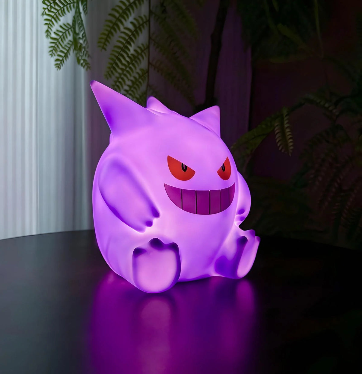 Gengar anime night light on desk with soft purple glow, aesthetic Pokémon room decor lamp for cozy bedroom lighting