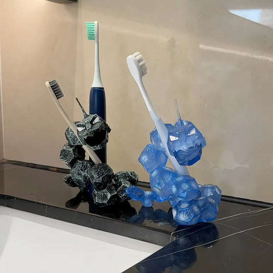 Onix-style toothbrush holder set in black and translucent blue holding toothbrushes on a bathroom counter