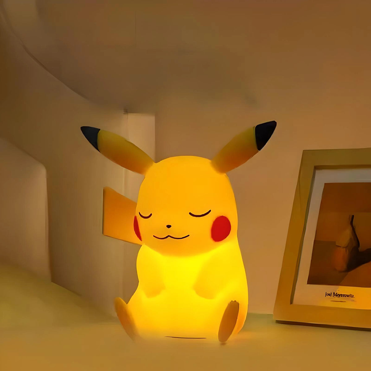 Glowing Pikachu night light on bedside table, warm LED anime lamp with soft silicone design, perfect for cozy bedroom lighting