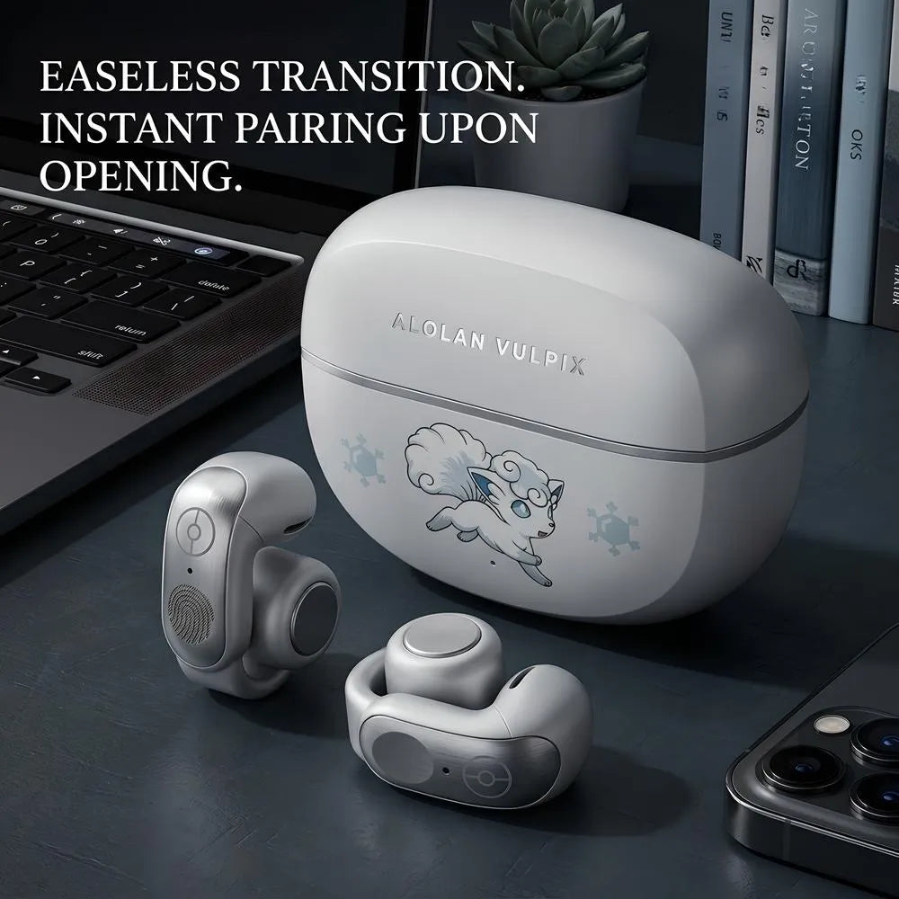 Alolan Vulpix themed white wireless earbuds and charging case placed next to a laptop and smartphone, showcasing instant auto-pairing feature in a modern desk setup.